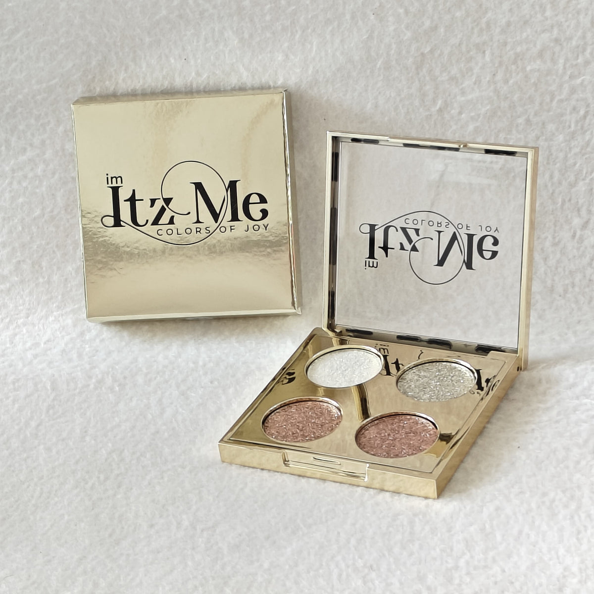 Itz Me Shimmer Palette Shade 01 with icy silver, champagne, rose gold, and bronze glitter shades in gold compact